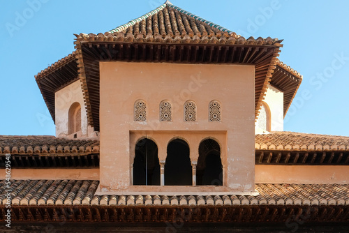 Spain, Granada, Arched windows and tiled roof of the Alhambra