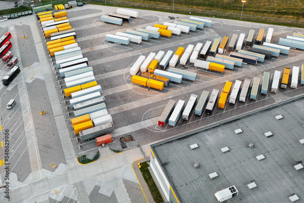 Aerial view of loading trucks in the logistics center of a large transport company