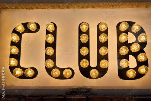 Close-up of illuminated club sign photo