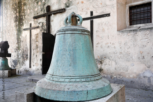 Mexico, Yucatan, Old bell on display in front of church photo