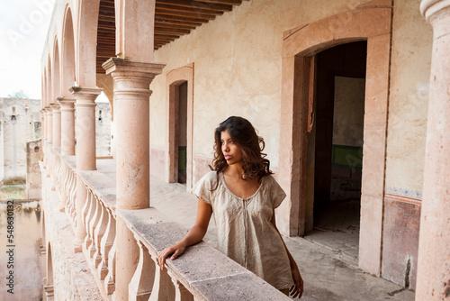 Mexico, San Felipe, Woman posing at old abandoned hacienda