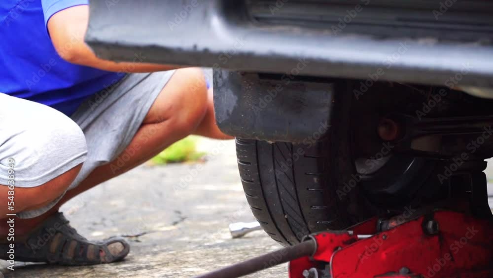 Man is changing fit car tires, slow motion shot. automotive stock videos. Man is changing fit car tires, slow motion shot. automotive stock videos.