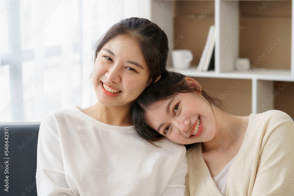 Happy LGBTQ Asian Lesbian Couple Two Asian girls show their love by cuddling and having romance together at home. Positive emotions and LGBT lesbian moments. Happy LGBTQ Asian Lesbian Couple Two Asian girls show their love by cuddling and having romance together at home. Positive emotions and LGBT lesbian moments.