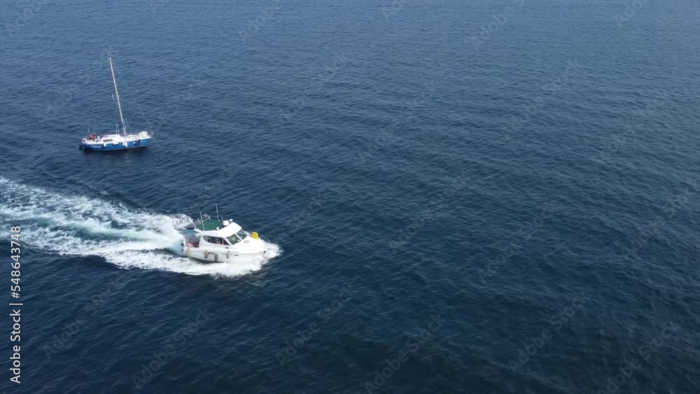 A motor boat sails on the blue sea A motor boat sails on the blue sea