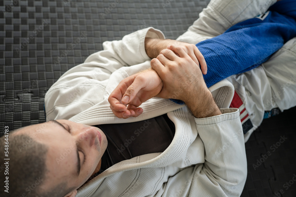Brazilian jiu jitsu armbar juji gatame submission arm lock BJJ Stock