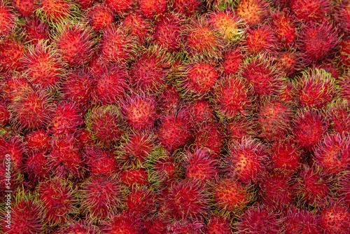 red rambutan fruit on background.