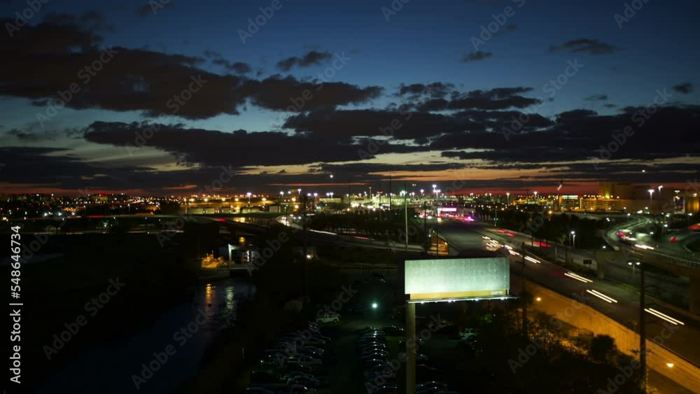 Timelapse Lockdown Of A Busy City Street And A Nearby Airport During Sunset - Miami, Florida Timelapse Lockdown Of A Busy City Street And A Nearby Airport During Sunset - Miami, Florida