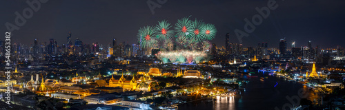 Panorama view of Bangkok with fireworks at Phra Phuttha Yodfa Bridge, Thailand.