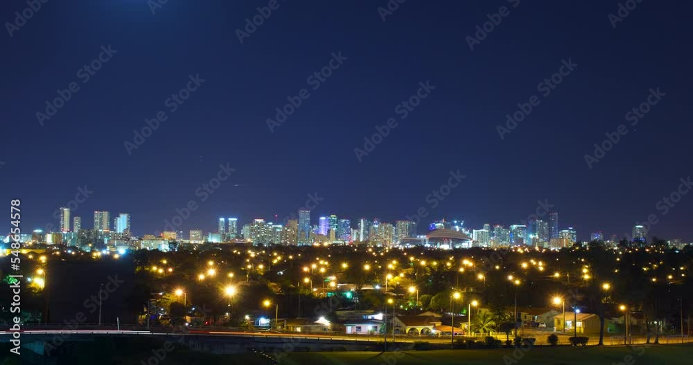 Timelapse Lockdown The Moon As It Rises Over A Bustling City Skyline At Night - Miami, Florida Timelapse Lockdown The Moon As It Rises Over A Bustling City Skyline At Night - Miami, Florida