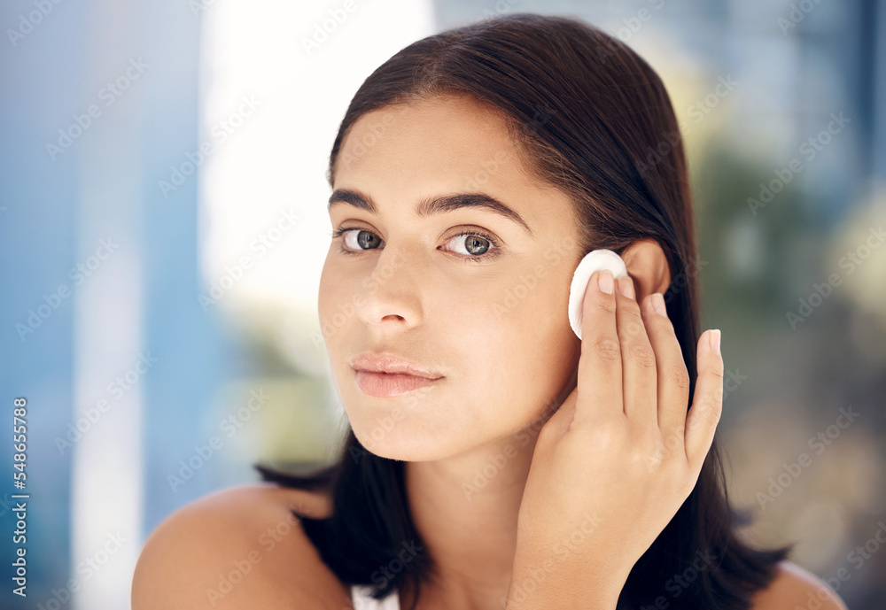Makeup, woman skincare and cotton pad face cleaning of a model doing a wellness facial. Young female portrait with cosmetics, dermatology and youth beauty wash with skin glow and health shine Makeup, woman skincare and cotton pad face cleaning of a model doing a wellness facial. Young female portrait with cosmetics, dermatology and youth beauty wash with skin glow and health shine