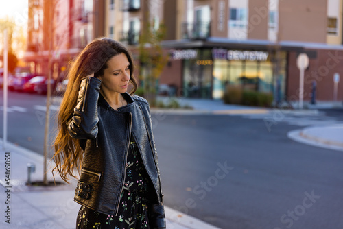 Young confident woman walking in the city