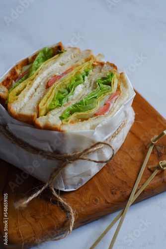 wrapped sandwich with cheese and vegetables 