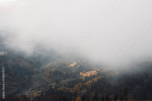 Autumn foggy landscape. Beautiful mountains view in the morning.