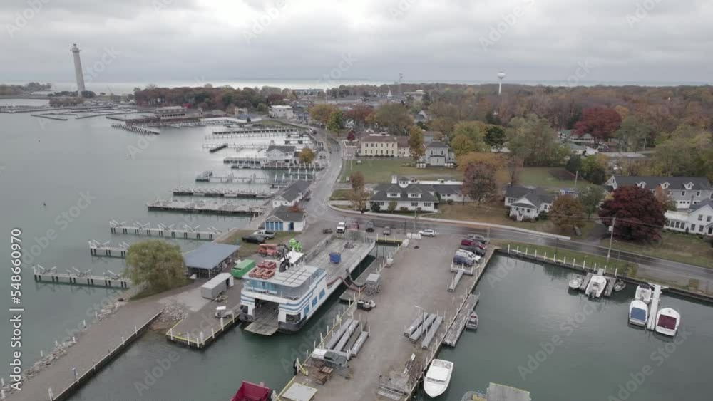 Cinematic aerial tracking shot of the harbor of Put-In-Bay area at Lake Erie with Perry's Victory and International Peace Memorial on the left, Ohio Cinematic aerial tracking shot of the harbor of Put-In-Bay area at Lake Erie with Perry's Victory and International Peace Memorial on the left, Ohio