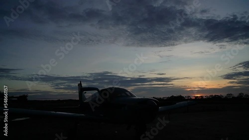 plane at sunset in the angar photo