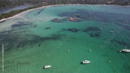 Wallpaper Mural Fishing boats at Santa Giulia Beach in the island of Corsica France in Mediterranean Sea, Aerial tilt up reveal shot Torontodigital.ca