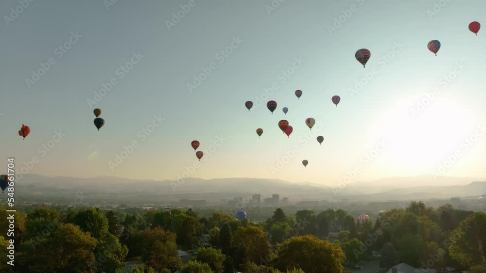 Wide establishing aerial view of the Spirit of Boise Hot Air Balloon festival in Idaho.