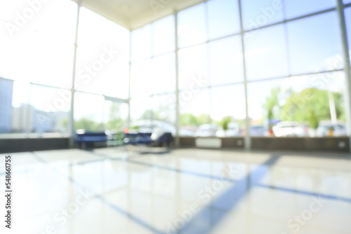 image of a spacious hall of a car dealership.