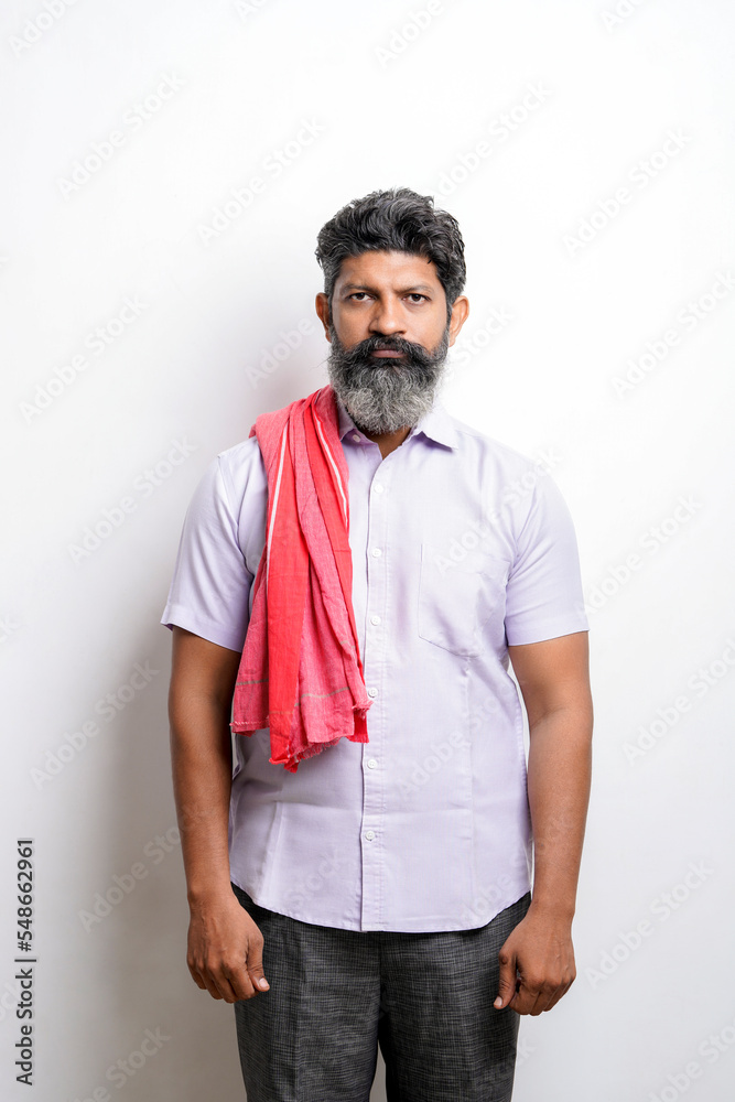 Fototapeta premium Indian farmer giving expression on white background.