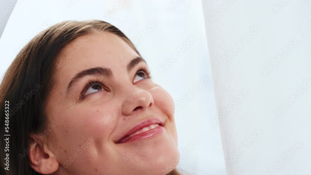 Happy, woman and smile for wellness, petals and curtain for skincare, health and content. Young female, confident girl and look up for happiness, peaceful or calm with motivation, vision or cosmetics Happy, woman and smile for wellness, petals and curtain for skincare, health and content. Young female, confident girl and look up for happiness, peaceful or calm with motivation, vision or cosmetics