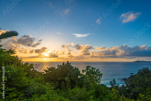 Fototapeta Naklejka Na Ścianę i Meble -  Setting sun viewed from the top of Pointe Millers on Praslin island, Seychelles