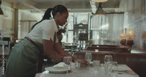 Wallpaper Mural Waitress  Preparing for Service, laying table in a Restaurant Torontodigital.ca