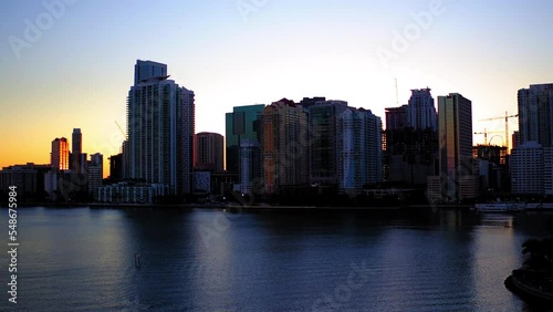 Wallpaper Mural Aerial Panning Shot Of Modern Buildings In City Against Clear Sky, Drone Flying Over Rippled Ocean At Sunset - Miami, Florida Torontodigital.ca