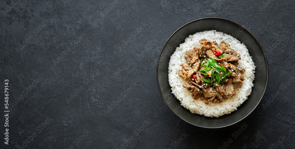 bulgogi with rice on a black background, traditional korean beef dish, asian food, top view, copy space bulgogi with rice on a black background, traditional korean beef dish, asian food, top view, copy space