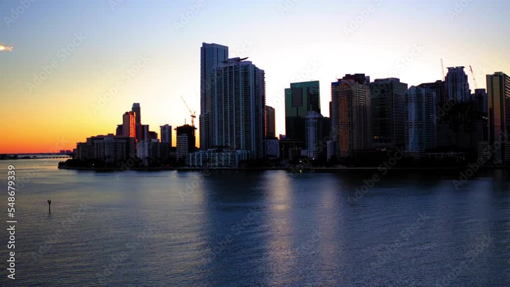 Lockdown Shot Of Tall Residential Towers In City By Sea During Sunset - Miami, Florida Lockdown Shot Of Tall Residential Towers In City By Sea During Sunset - Miami, Florida