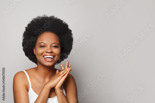 Cheerful perfect excited surprised happy young woman posing on white studio wall background