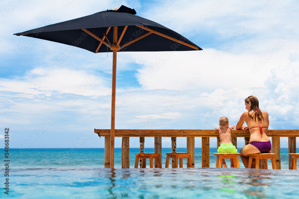 Pool Side Positive Image Young mother with happy baby son have fun relaxing at poolside beach ...