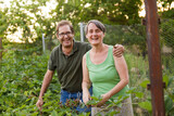 Adult couple farming together having a great time