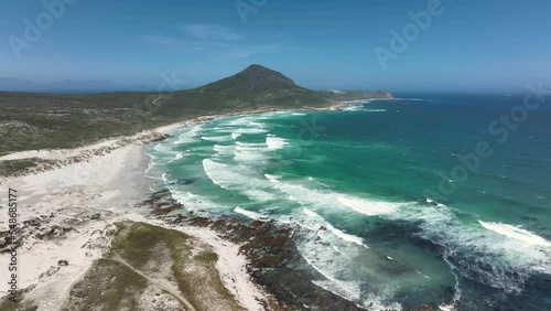 Aerial footage of a vast blue ocean in Platboom Beach, South Africa, in sunny weather photo