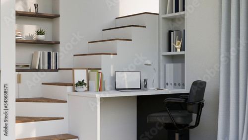 Fotografie Home working space in minimal white style with laptop on white desk against the