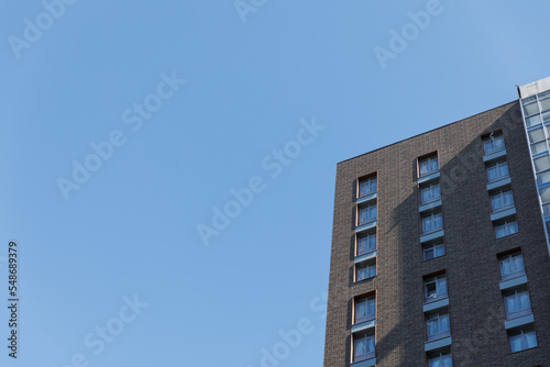 A new high-rise building against the blue sky.  © Anna
