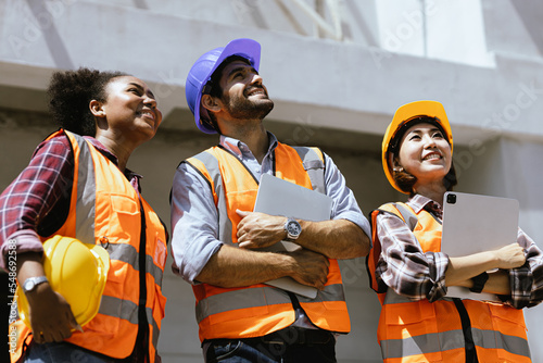 Wallpaper Mural Industrial maintenance engineer team, dark skinned woman wearing helmet, uniform and safety under inspection engineer, construction concept. Torontodigital.ca