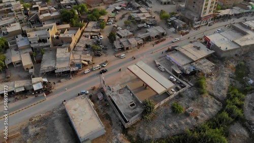 Aerial shot of village roads and houses of Rohri Sindh.  Aerial shot of Rohri city in Sindh province in Pakistan in summer during day time.	 photo