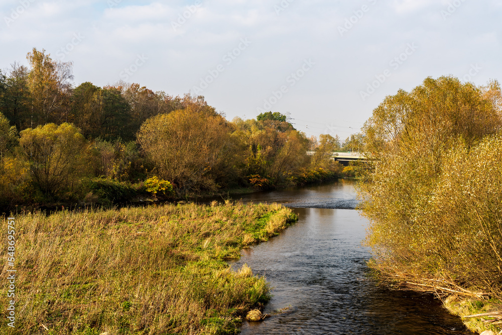 Wisla and Brennica river tributary near Skoczow city in Poland during autumn Wisla and Brennica river tributary near Skoczow city in Poland during autumn