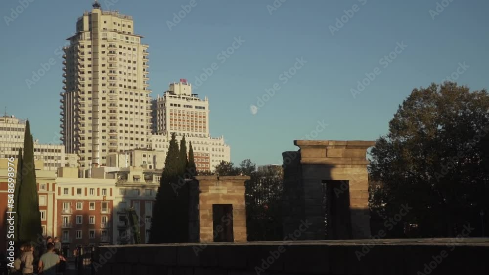 Skyscraper in Madrid with moon far away Skyscraper in Madrid with moon far away