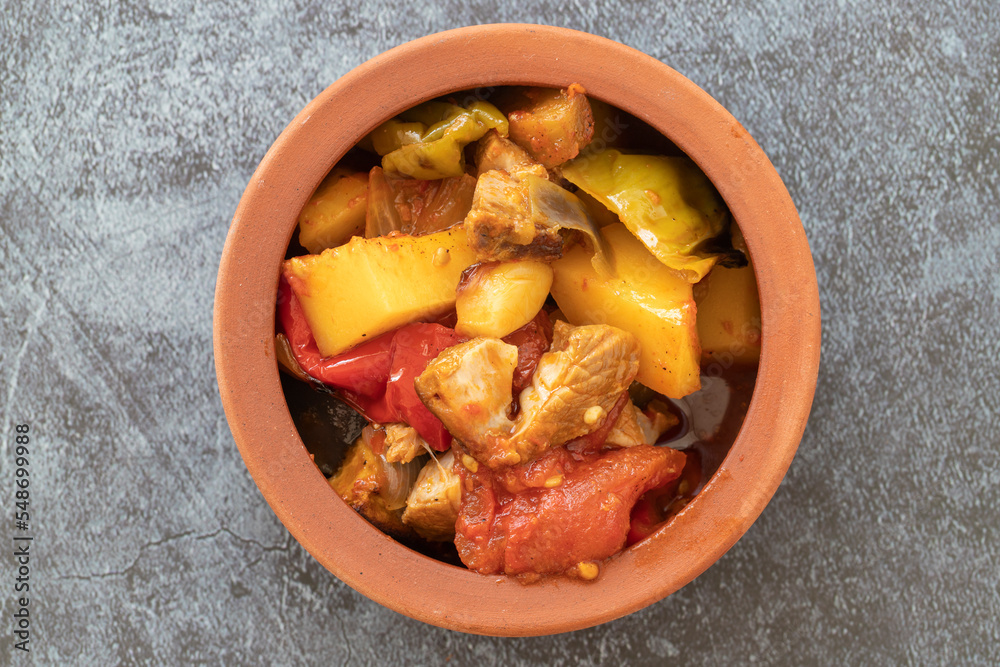 Top view of Turkish dish Guvech - baked meat with eggplant and traditionally served in earthenware pot (Turkish name; etli patlican guvec) Top view of Turkish dish Guvech - baked meat with eggplant and traditionally served in earthenware pot (Turkish name; etli patlican guvec)