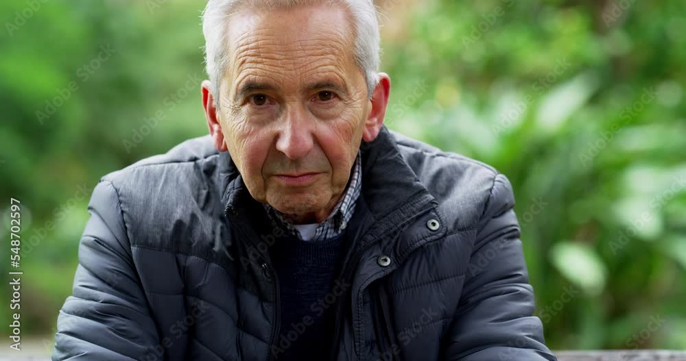 Senior man face in garden, depression and nature or senior care with healthy nostalgic lifestyle. Mental health, lonely old man thinking on park bench with sad portrait and alone time in retirement.
