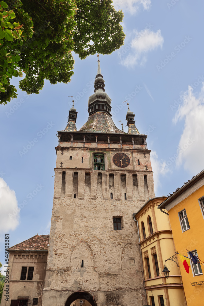 What makes this Clock Tower of Sighisoara (Turnul cu Ceas) unique in all country is its clock with puppets inside. Transylvania, Romania (vertical photo)