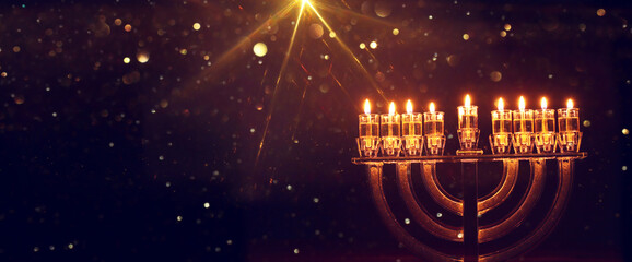 Image of jewish holiday Hanukkah with menorah (traditional candelabra) and candles