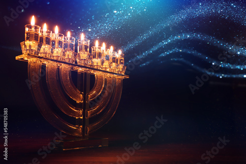 Image of jewish holiday Hanukkah with menorah (traditional candelabra) and candles photo