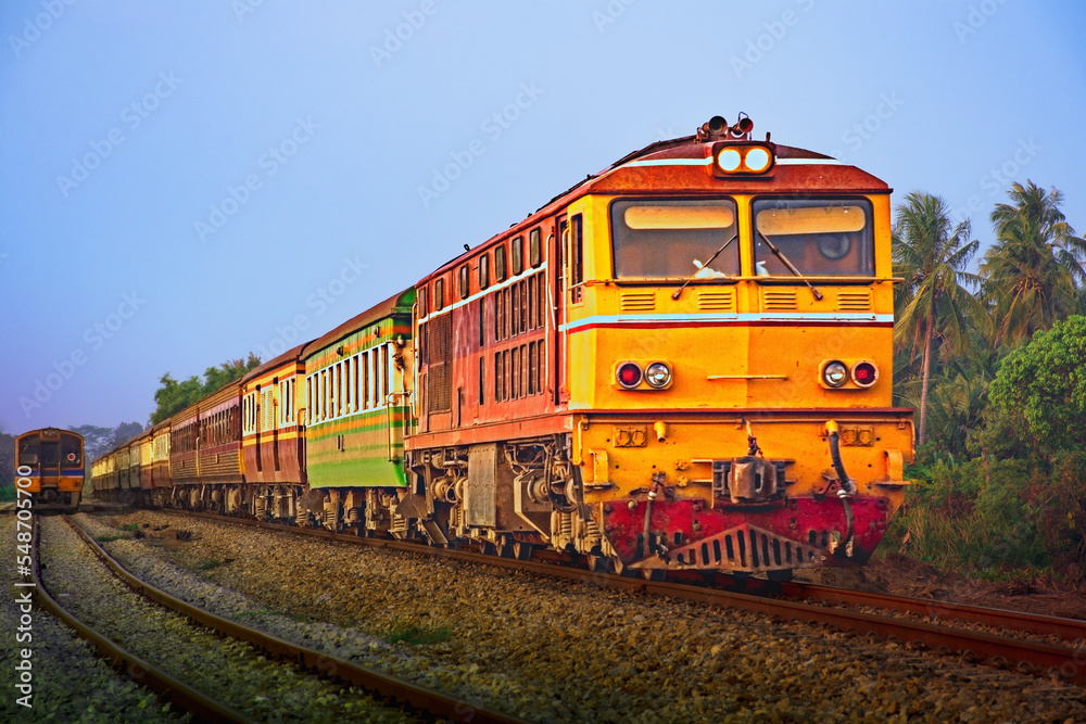 Passenger train by diesel locomotive on the railway. Passenger train by diesel locomotive on the railway.