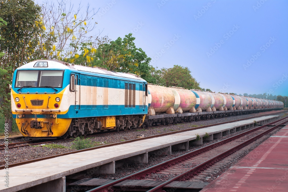 Fototapeta premium Freight train by diesel locomotive on the railway.