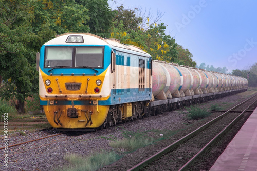 Freight train by diesel locomotive on the railway.