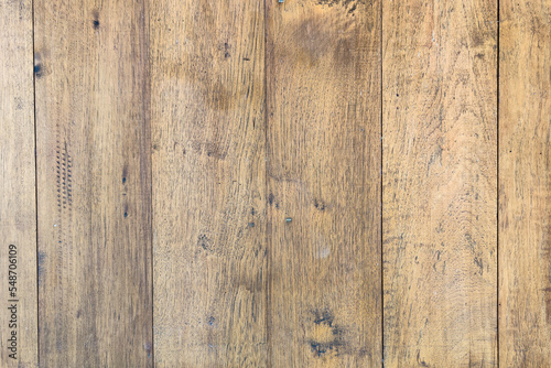 Natural wood floor texture. Wood prank with worn out surface. Teak background and vertical line.