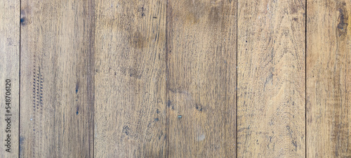 Natural wood floor texture. Wood prank with worn out surface. Teak background and vertical line.