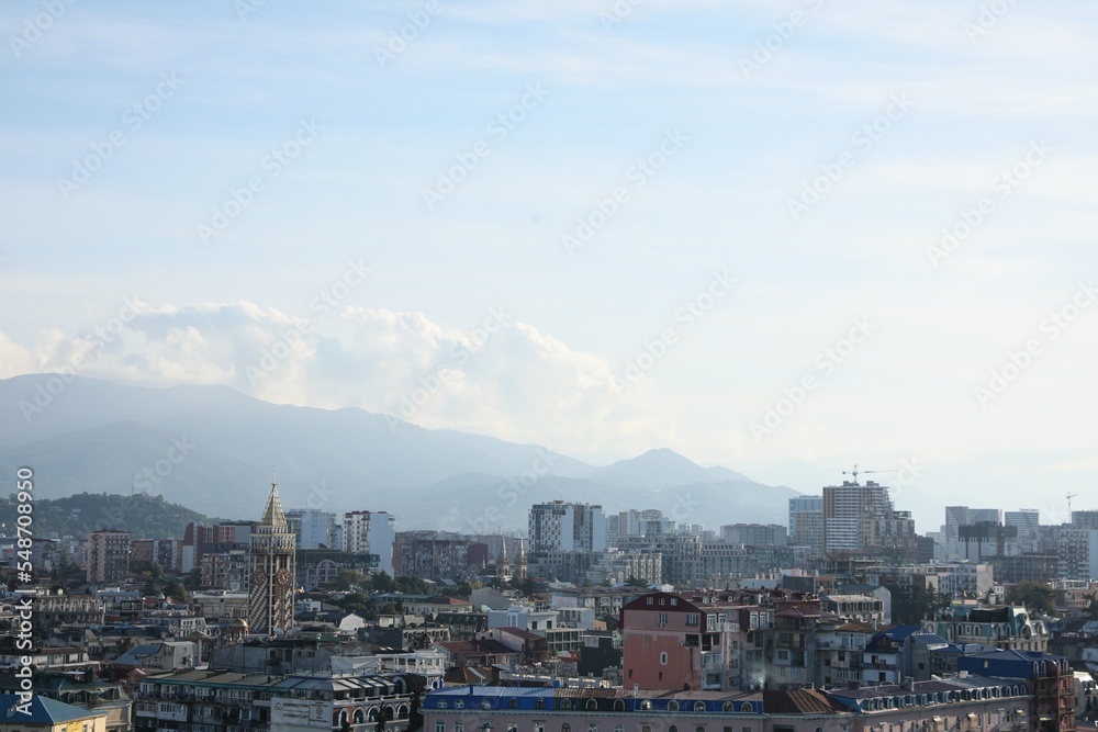Picturesque view of modern city near mountains
